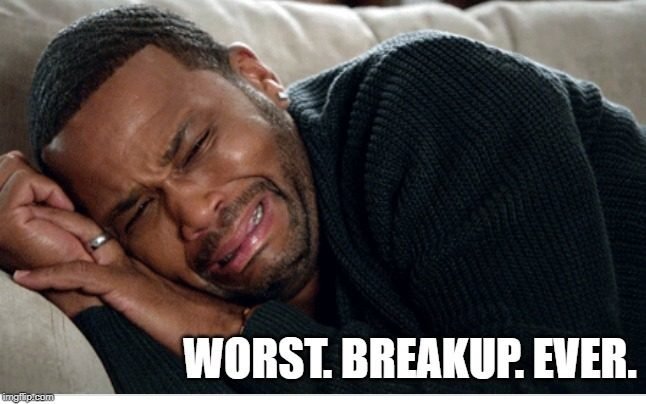 Man crying on the bed with caption: worst breakup ever